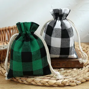 Classic Christmas plaid drawstring gift bags in green and white buffalo check pattern