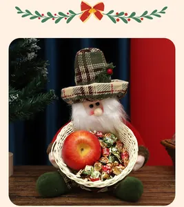 Festive Santa plush doll holding a small woven candy basket with an apple