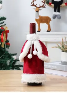 Detailed view of the festive red velvet Christmas wine bottle cover with white fur trim.