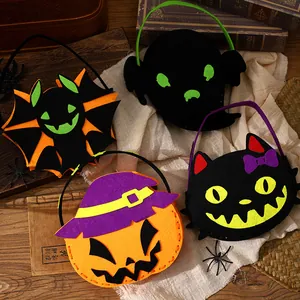 Set of four Halloween felt candy bags featuring pumpkin, bat, ghost, and cat designs.