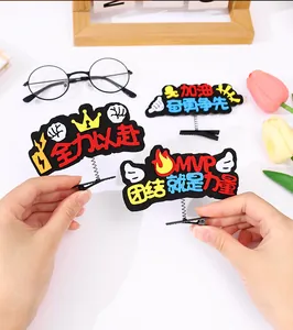 Detailed macro shot of creative spring hair clips featuring motivational slogans for sports