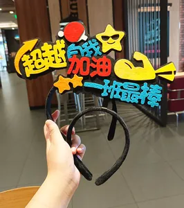 Close-up of sports meet cheering headband with colorful felt text patches for students