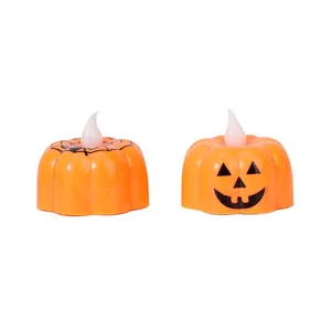 Halloween pumpkin LED tea lights with Jack-o'-lantern and spider web patterns