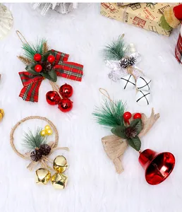 Detailed view of festive Christmas bell hanging ornaments with pine needles and bows