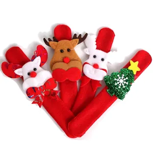 Close-up of red Christmas slap bracelets featuring reindeer and festive tree characters