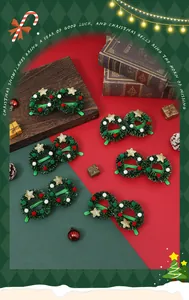 Detail shot of festive green wreath glasses frames with gold stars for Christmas parties.