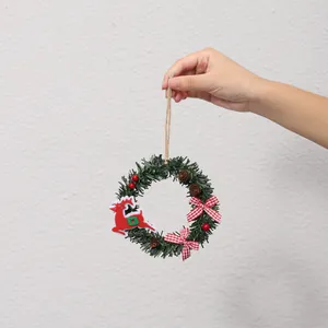 Mini decorative Christmas wreath ornament featuring red reindeer, pine cones, and checkered bows