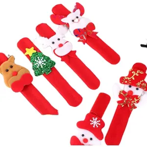 Close-up of festive red Christmas slap bracelets with reindeer and snowman characters