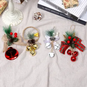 Set of four festive Christmas bell ornaments with bows and pine needles for tree decor.