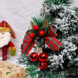 Festive Christmas tree hanging ornament with red jingle bells and decorative plaid bow.