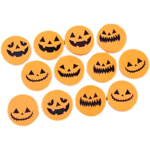 Assorted orange Halloween Jack-o'-lantern round erasers with spooky printed expressions