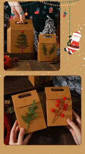Close-up of Christmas kraft paper gift bags with tree and berry decorative elements.