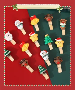 Assorted Christmas wooden clips with festive cartoon charms for DIY photo wall decor