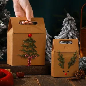 Decorative Christmas kraft paper gift bags with reindeer and tree designs for holiday treats