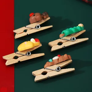 Creative Christmas wooden clips with cartoon characters for festive DIY photo wall decor