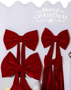 Detailed close-up of large red velvet Christmas bows for tree and scene decoration