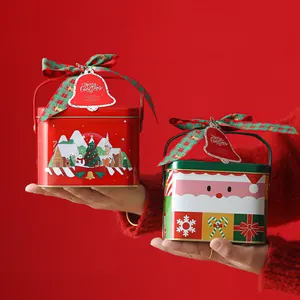 Festive Christmas tin gift boxes with ribbons and decorative tags for sweets