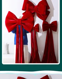 Macro detail of oversized red velvet Christmas bows used for festive tree decoration