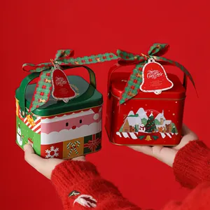 Handheld Christmas tinplate gift boxes in red and green with festive holiday patterns