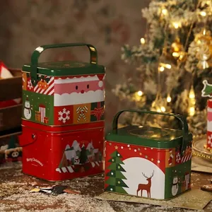 Scatole regalo natalizie festive in latta con illustrazioni di renne e Babbo Natale per pacchi