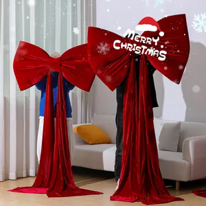 Extra large red velvet Christmas bow decorations for a festive holiday atmosphere