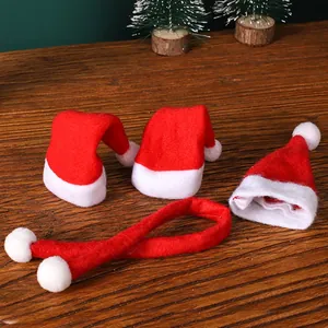 Set of mini red non-woven Santa hats and matching scarf for Christmas bottle decoration