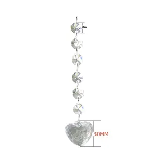 Detail of transparent crystal bead pendant with 30mm heart and 14mm octagonal beads.