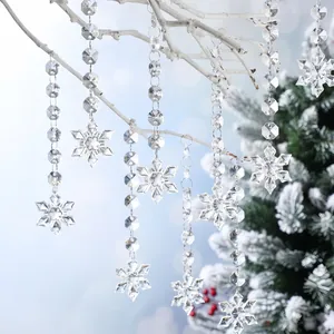 Detail view of transparent crystal bead chains with snowflake pendants for Christmas decoration