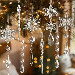 Clear acrylic Christmas snowflake and icicle ornaments hanging with warm bokeh lights