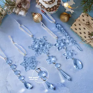 Close-up of blue crystal snowflake ornaments with high-quality metal rings for Christmas decor.