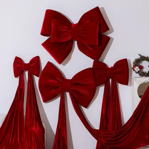 Large red velvet Christmas bows for festive hanging decoration and tree ornaments