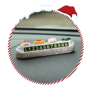 Detailed macro shot of a cute Christmas rhinestone car temporary parking phone number plate.