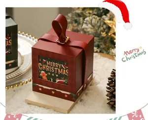 Festliche rote Weihnachtsgeschenkbox mit einem Ledergriff und Merry Christmas Grafikdetail