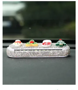Close-up view of a rhinestone temporary car parking card with cute Christmas decors