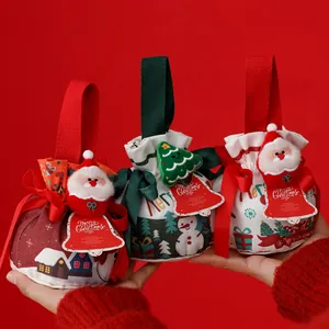 Set di sacchetti regalo di Natale festivi con decorazioni in peluche di Babbo Natale