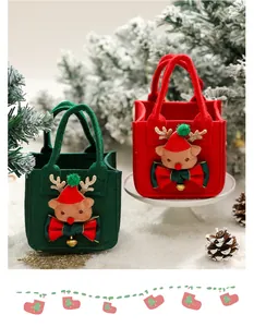 Detail shot of red and green Christmas felt gift bags with cute 3D reindeer decorations.