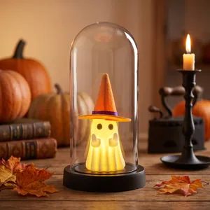 Glowing Halloween white ghost night light in glass dome with orange witch hat ornament