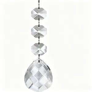 Detailed view of clear faceted crystal teardrop bead for Christmas tree and wedding decor