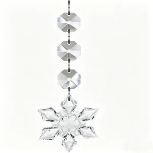 Detailed view of transparent crystal snowflake pendant with faceted octagonal beads