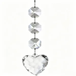 Close-up view of faceted transparent octagonal beads and heart pendant decoration