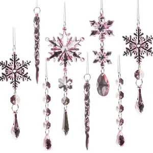 Set of pink transparent crystal snowflake and icicle ornaments for Christmas tree decor.
