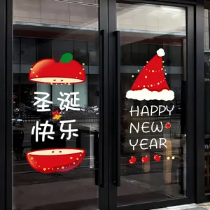 Festive Christmas static window stickers featuring red apple and Santa hat decorations