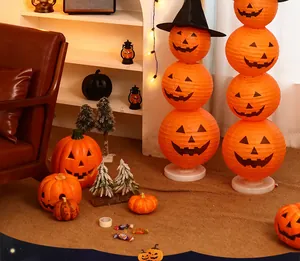 Cozy interior scene featuring various stacked Halloween pumpkin paper lanterns and decorations