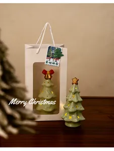 Decorative ceramic Christmas tree night lights with glowing stars inside gift packaging