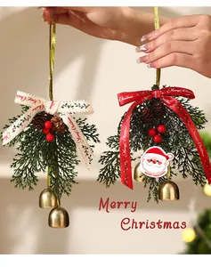 Detail of festive Christmas hanging ornaments with pine branches, red berries, and bells