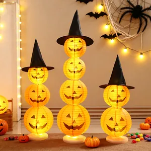 Stackable glowing Halloween pumpkin paper lanterns with witch hats for festive indoor decor