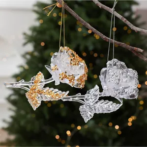 Detailed macro view of transparent acrylic rose ornaments with gold and silver glitter