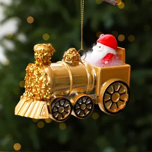 Detailed close-up of a golden Santa Claus train locomotive ornament for Christmas trees