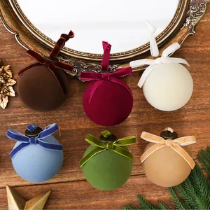 Detailed view of colorful velvet Christmas baubles with elegant ribbons and bows