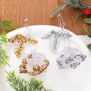 Close-up of elegant gold and silver glitter acrylic rose Christmas tree ornaments